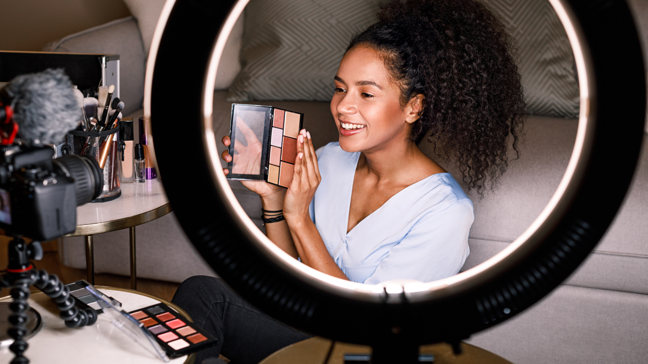 Beauty Influencer Filming Skincare Review Without Filters Beauty content creator using ring light to film a makeup or skincare product review