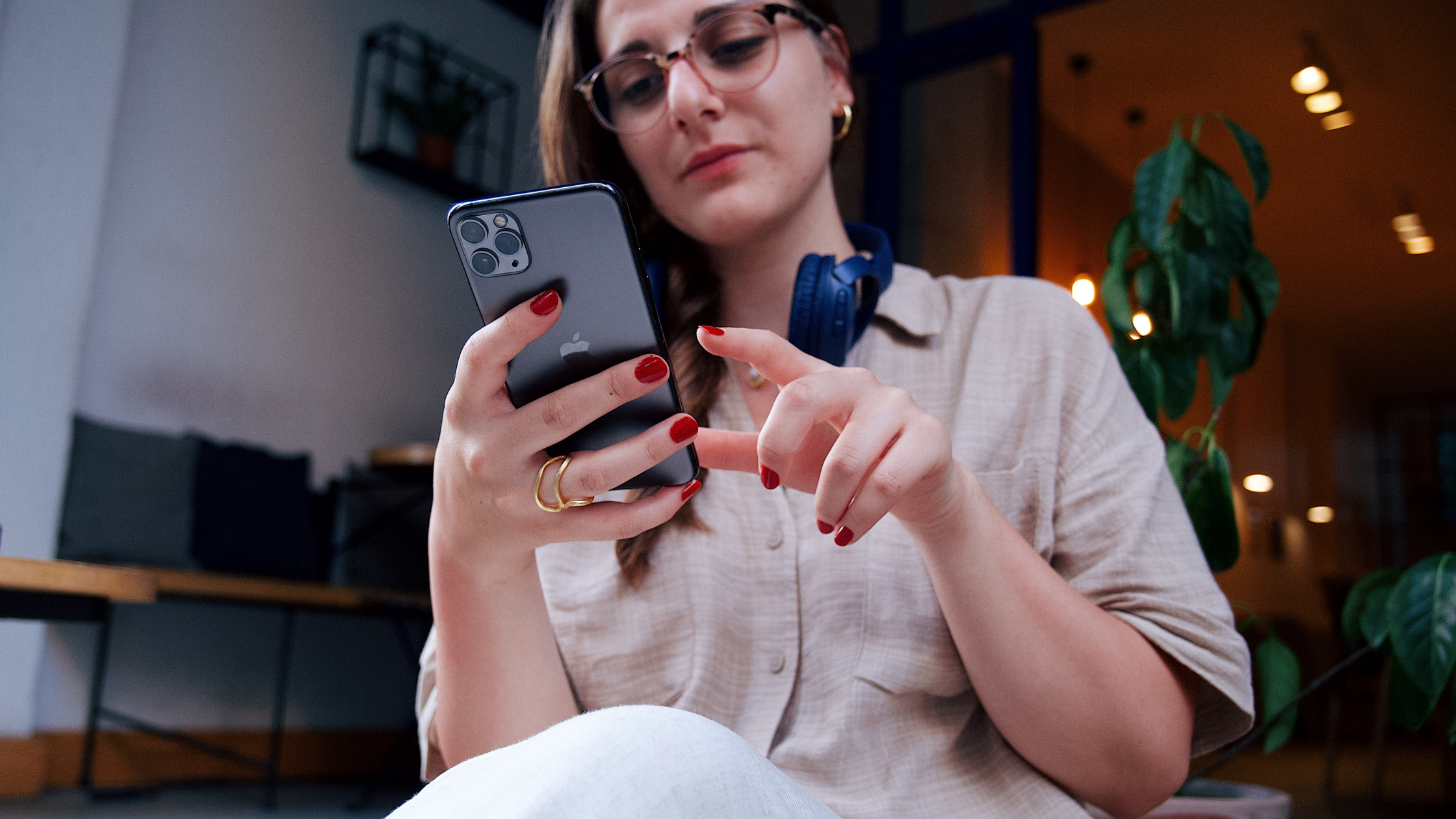 Woman checking social media notifications on her smartphone