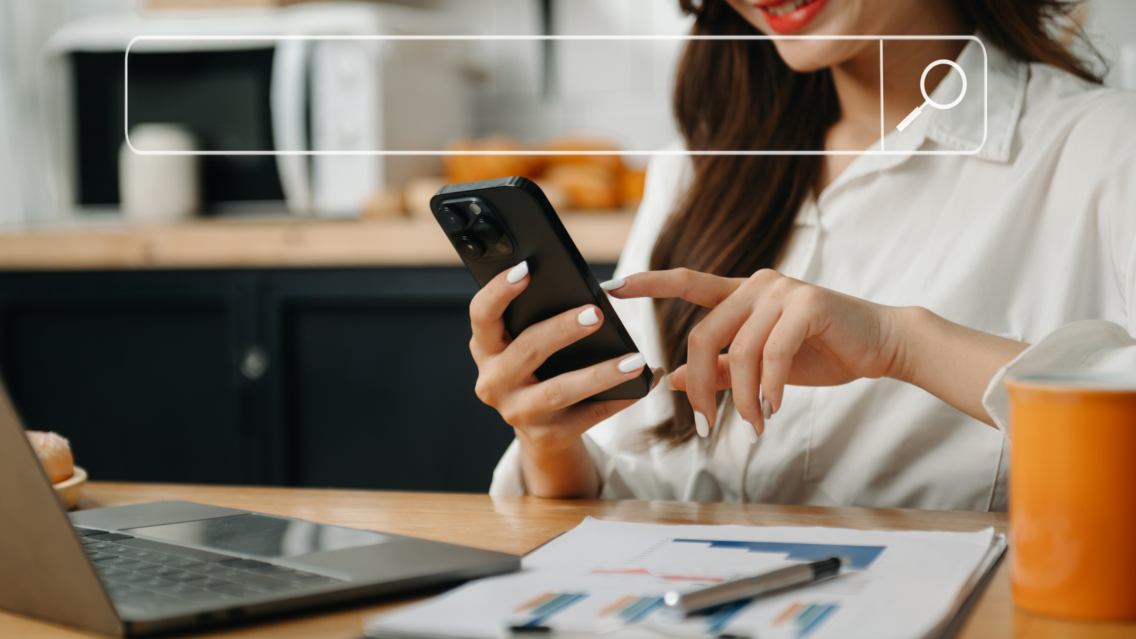 Woman analyzing data on smartphone with laptop and charts, representing social media research and decision-making