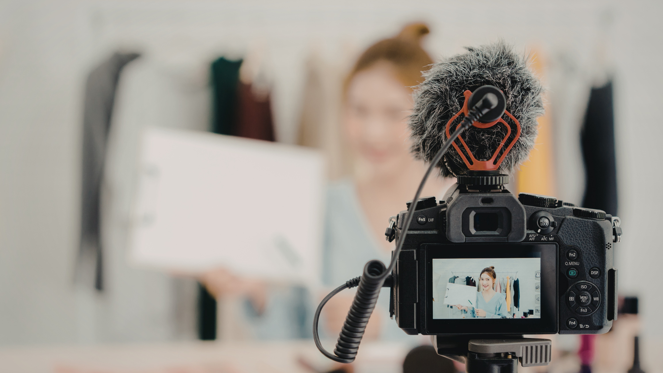 Professional camera recording a content creator filming user-generated content for social media marketing.
