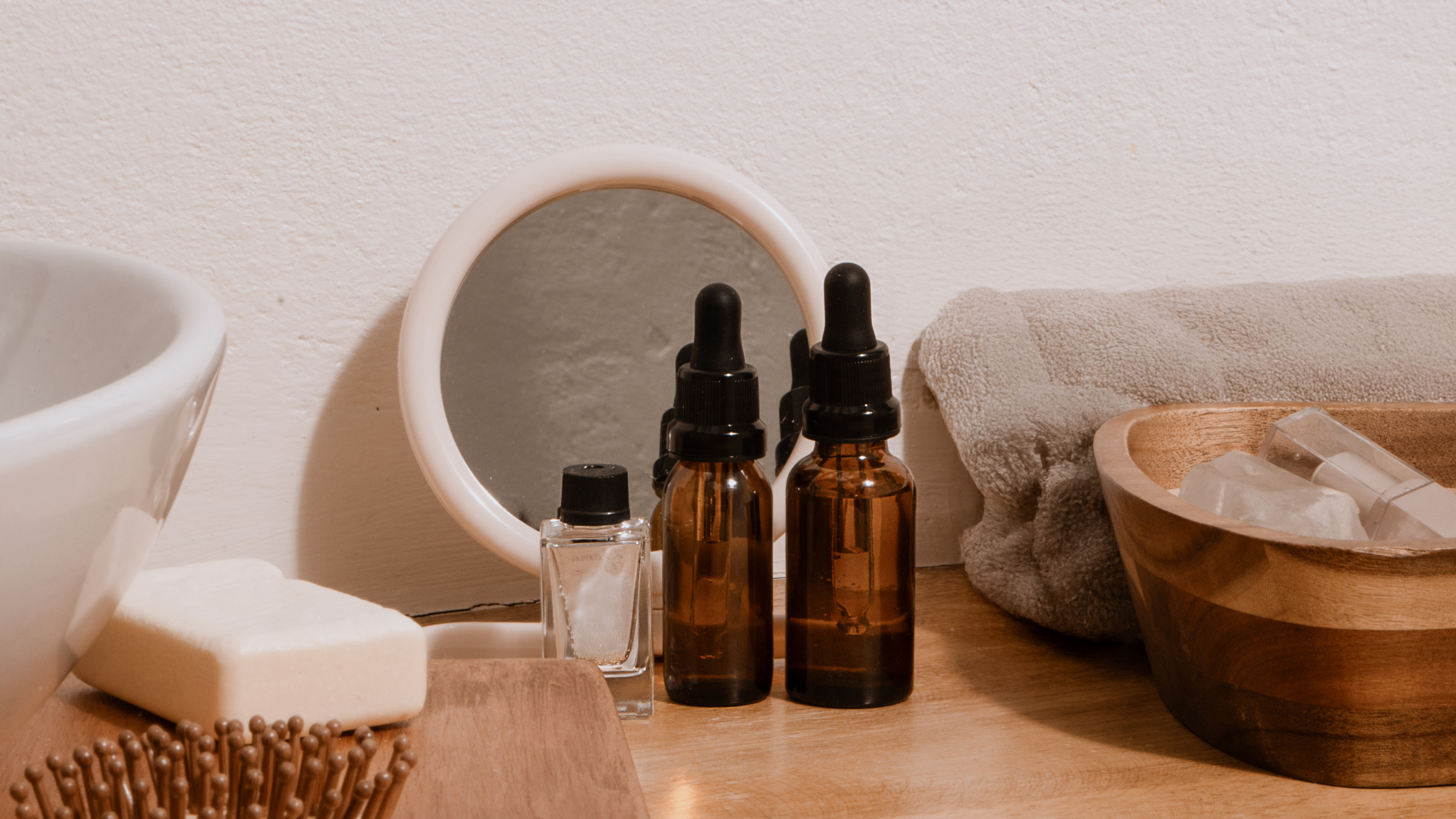 Skincare and wellness products displayed in a natural lifestyle setting for beauty brand content marketing.
