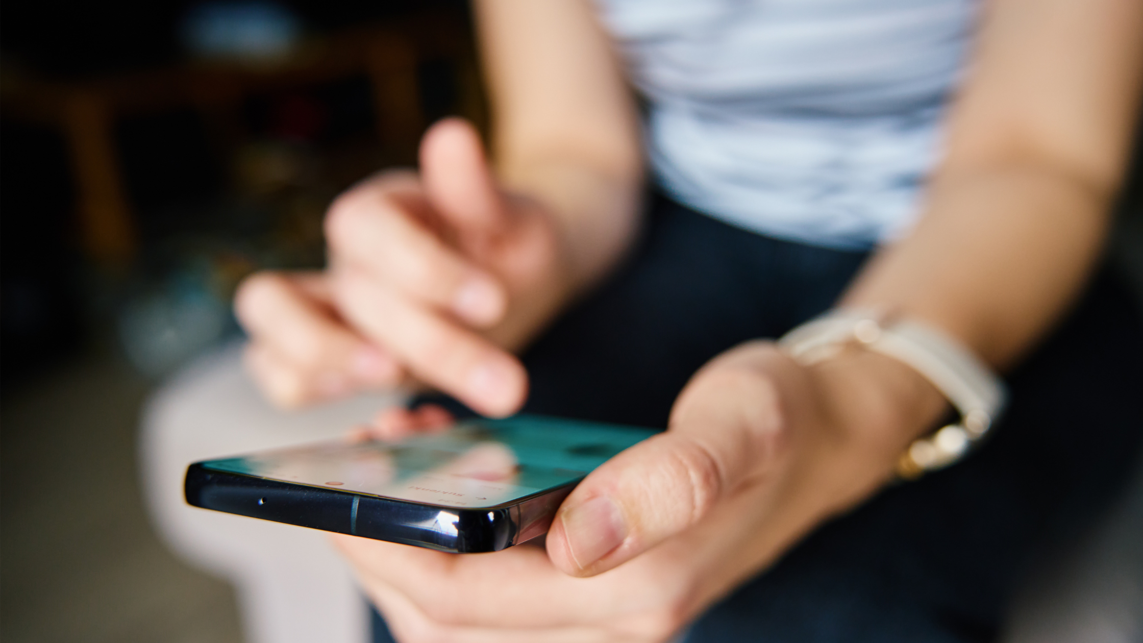 Person scrolling social media on a smartphone reflecting audience engagement
